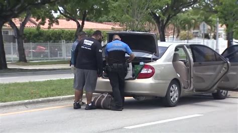 Driver accused of running down officer taken into custody in NW Miami-Dade